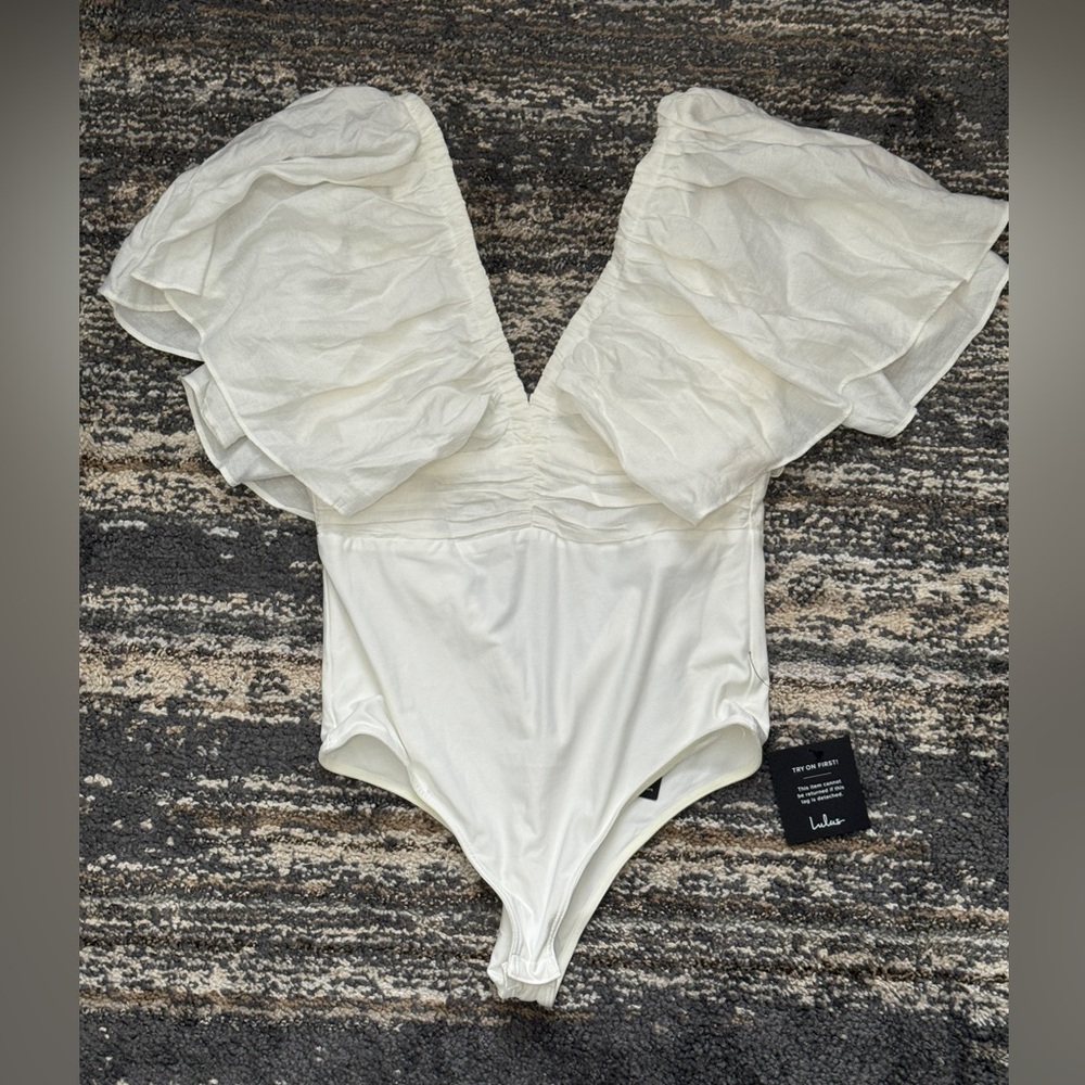 Elegant White Ruffled Bodysuit